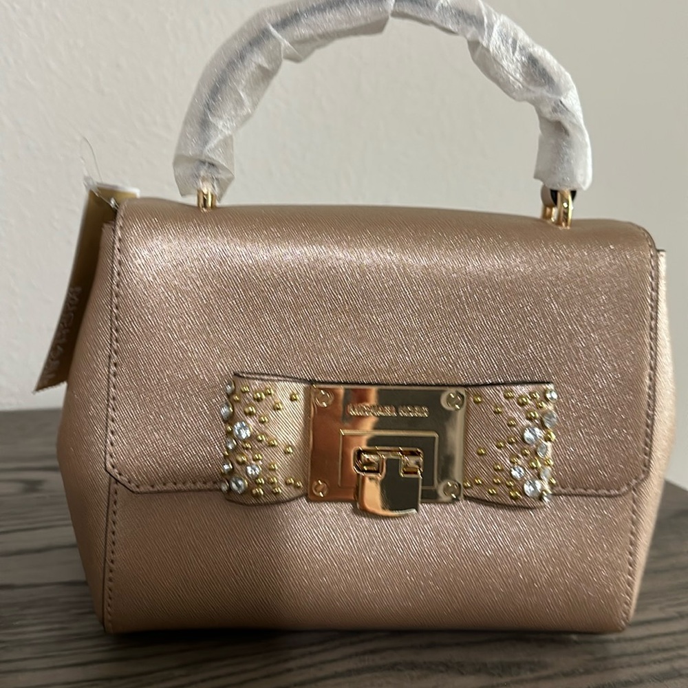 Tina Micheal Kors gold purse